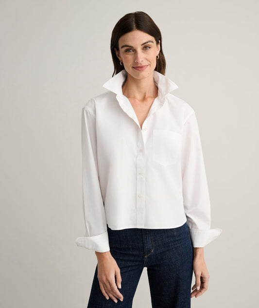 Model is wearing UNTUCKit Crosby dress in white.