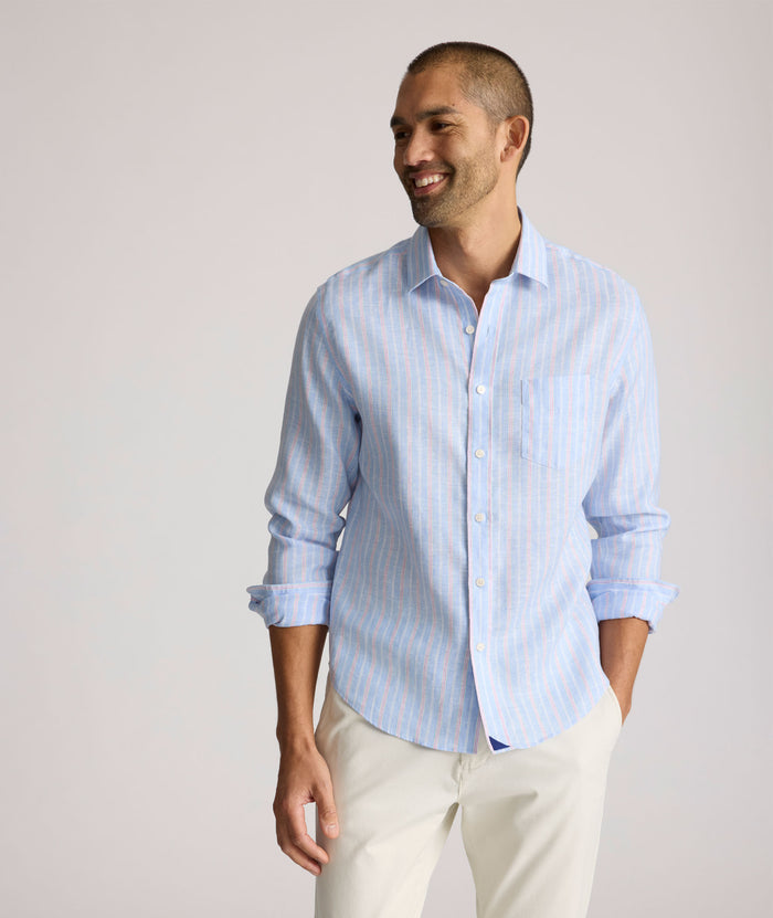 Model is wearing UNTUCKit Boyd  light blue stripe linen shirt.